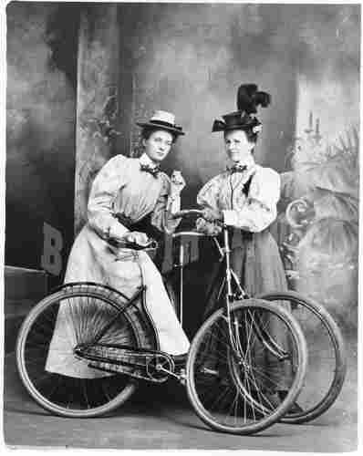 Fashionable Ladies Posing With Bikes